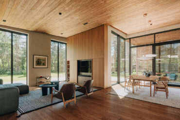 Elegant living room Thermory Benchmark thermo-radiata pine ceiling blending timeless craftsmanship with sustainable Nordic design.